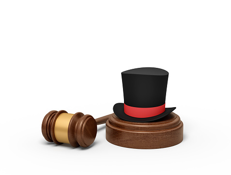 3d rendering of black top hat with red ribbon on sounding block with judge gavel lying beside. Court trial. Civil court. Headline-making case.