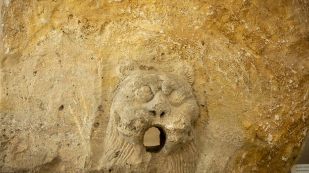 istock a lion mouth statue in a pipe 2093198276