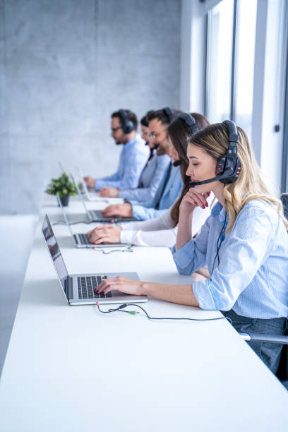 istock Customer support agent woman listening to client's inquiries, demonstrating her dedication providing top-notch service 2093218129