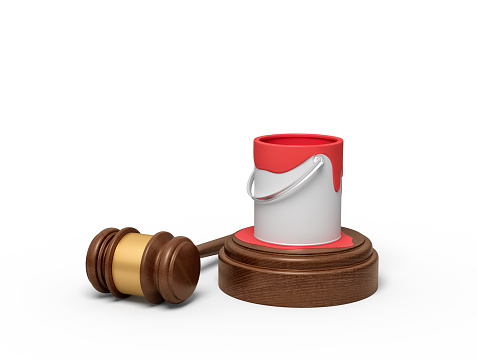 3d rendering of open can of red paint standing on sounding block with some paint spilt, with judge gavel lying beside. Criticize art. Protect art. Creativity under pressure.