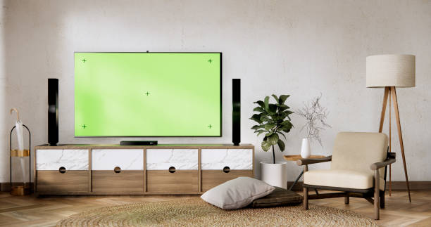 istock Smart Tv Mockup with blank green screen hanging in modern white empty room interior minimal designs. 2093243813