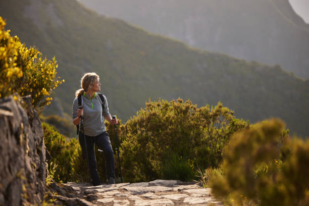 istock Carefree female backpacker hiking on a mountain. 2093257831