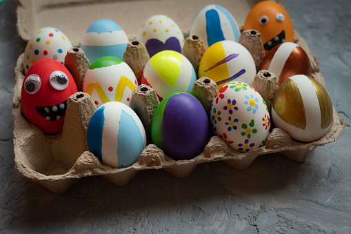 colored painted eggs on the table, easter holiday concept