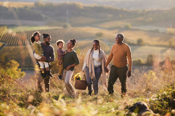 istock Happy black multi-generation family going on a picnic in autumn day. 2093291175