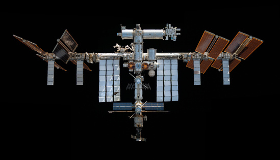 International Space Station over black background. Elements of this image furnished by NASA.