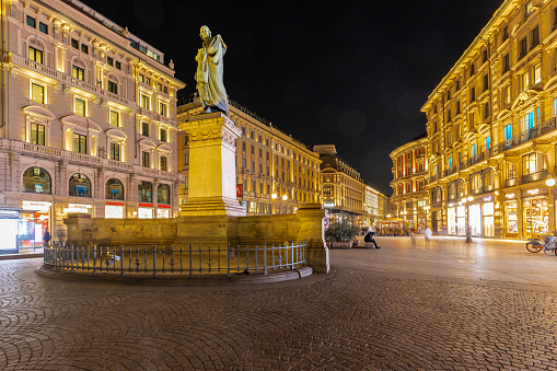 Milan, Italy 03-07-2024 Night view of Piazza Cordusio, a square in the centre of Milan and It is well known for its several turn-of-the-19th-century Neoclassical, eclectic and Art Nouveau buildings