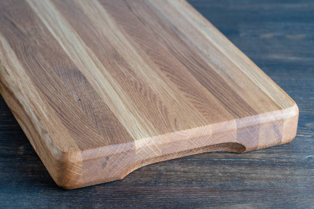 istock Wooden cutting board on wooden table background 2093328460