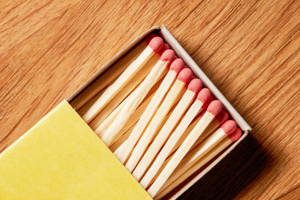 istock A slightly opened box of matches on a wooden background. Top view. 2093375634