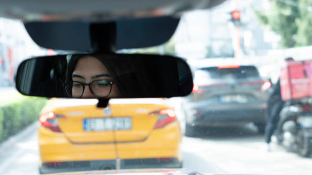 istock woman driving car 2093375636