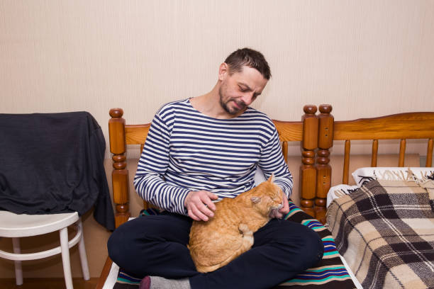 istock a man is friends with a cat 2093376152