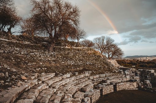 Antient Amphitheatre of Teos with a Rainbow. Teos Ancient City is located in Seferihisar town of Izmir province. Founded in 1050-1000 BC