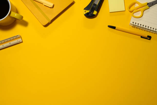 istock Various office supplies on yellow background. Flat lay, top view with copy space 2093408263