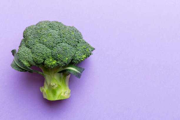 istock Top view fresh green broccoli vegetable on Colored background. Broccoli cabbage head Healthy or vegetarian food concept. Flat lay. Copy space 2093418095