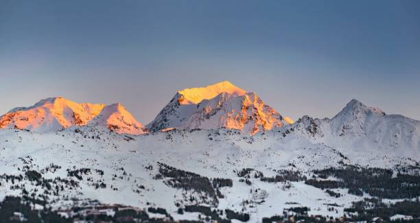 istock sunset on snowy mountain peak in alpine ski resort 2093440123