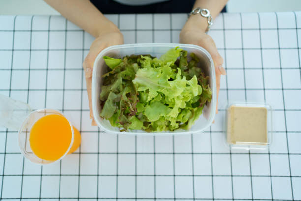 istock Woman eating salad. 2093473739