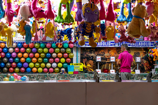 Dart throwing game at an open air fair in a tombola in Valladolid - Spain