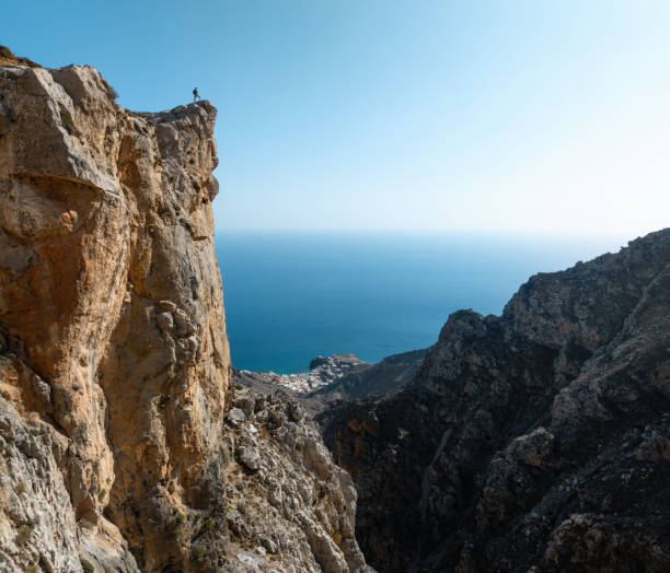 istock Man On The Edge Of The Cliff 2093510516