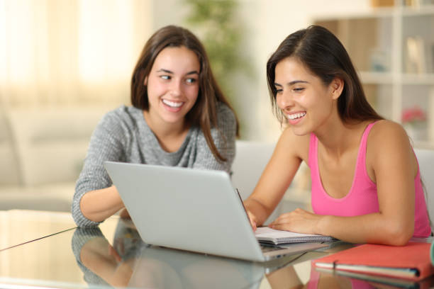 istock Private teacher teaching to a happy student at home 2093511606