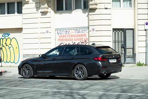 Bilbao, Spain - 15 March 2024: A BMW 5 Series Touring car in an urban street