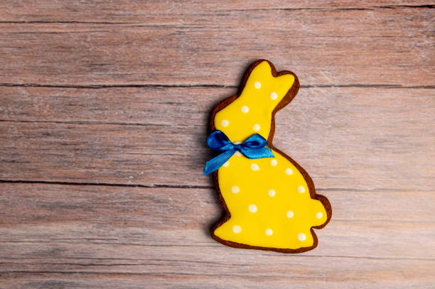 istock Easter gingerbread cookie on  wooden table. Bunny shaped cookies for Easter 2093523649