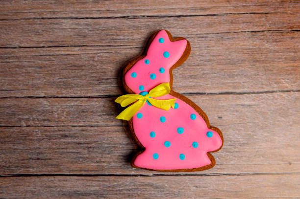 Easter gingerbread cookie on  wooden table. Bunny shaped cookies for Easter