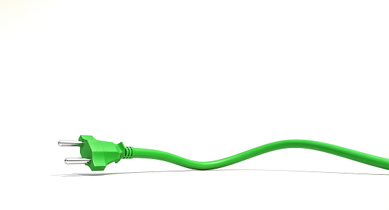 Eco-friendly energy concept with a vibrant green power cord artistically bent, isolated on white