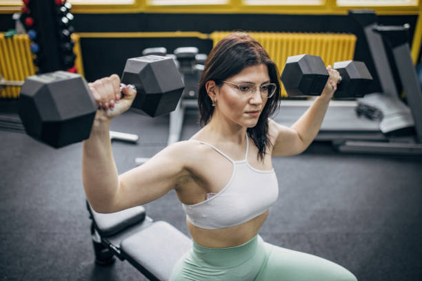 istock Woman training with dumbbells 2093533778