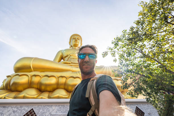 He smiles at the camera, happy to discover the gems in Asia