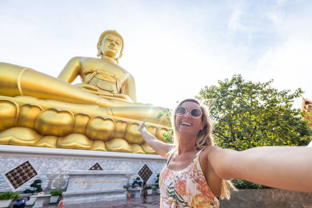 She smiles at the camera, happy to discover the gems in Asia