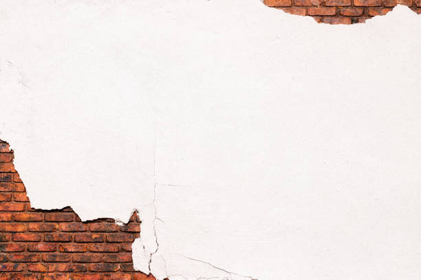 istock old crumbling white plaster, texture of peeling putty from a brick wall 2093556815