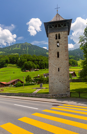 Old church tower Alter Kirchturm in swiss village Lungern, canton of Obwalden, Switzerland