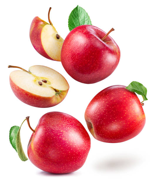 istock Red apples and red apples slices levitating in air isolated on white background. 2093596714
