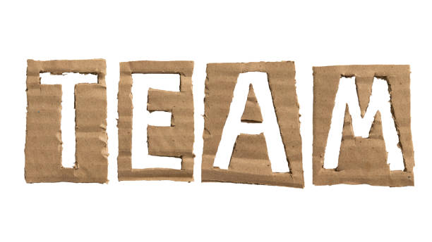 слово «команда», сделанное из картона - origami old fashioned letter m script стоковые фото и изображения
