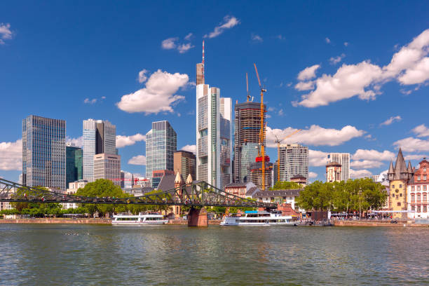 Picturesque view of business district with skyscrapers along river in Frankfurt am Main, Germany