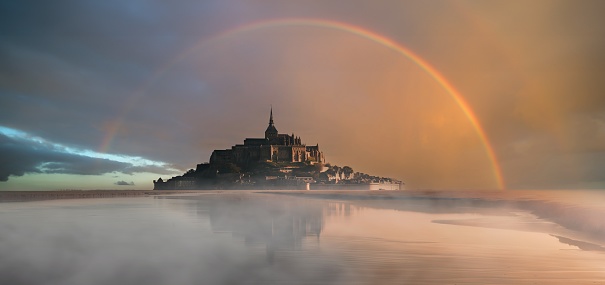 A vibrant rainbow above Mont Saint-Michel. Normandy, France