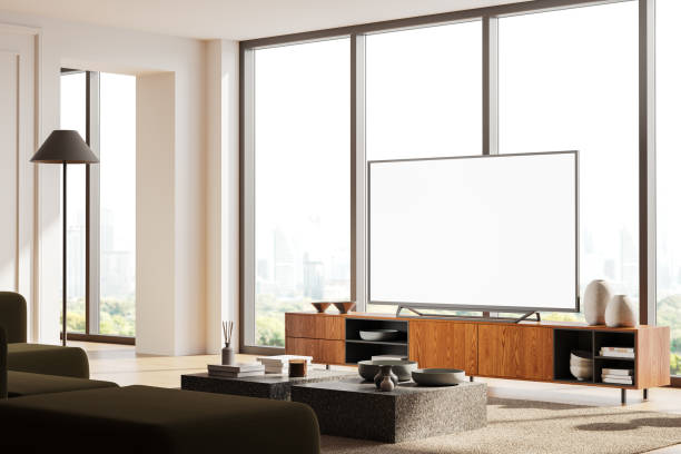 istock Stylish home living room interior with tv on console, window and mockup screen 2093676624