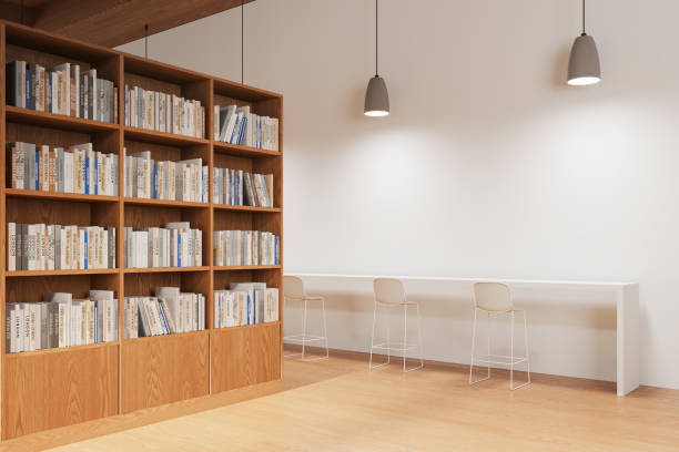 istock Modern library interior with bookshelf, reading space with desk and stool 2093680881