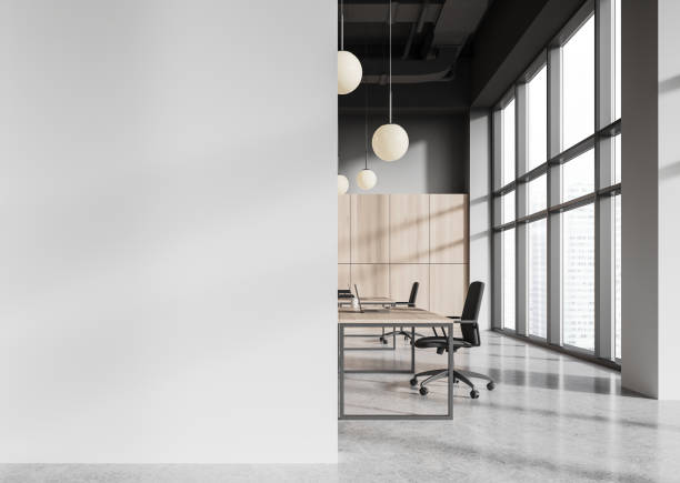 istock Office coworking interior with desk and laptop, panoramic window. Mock up wall 2093693225