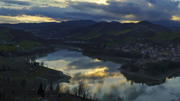 istock sunset sky reflecting on Lake Mercatale 2093699284