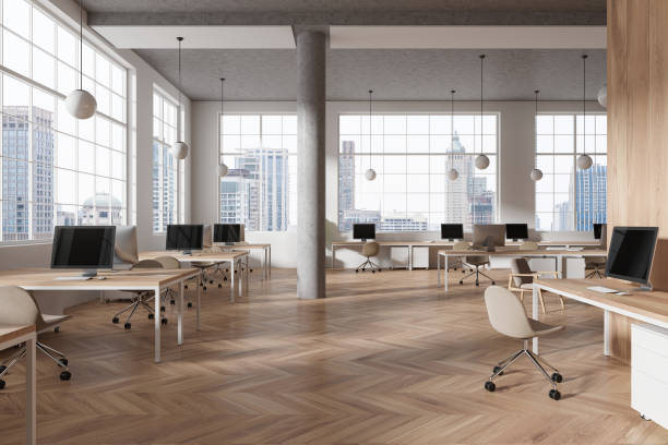 istock Office coworking interior with desk and pc monitors, panoramic window 2093704958