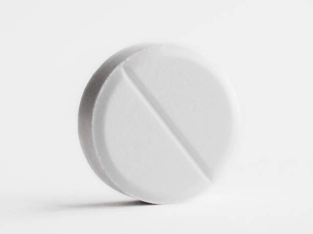 istock One pill isolated on white. Drug therapy 2093724164