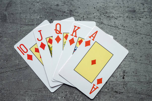 istock Diamonds royal flush playing cards poker combination on grey background 2093737712
