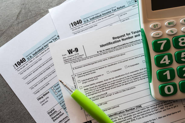 istock Tax time concept blank form with calculator. 2093743556