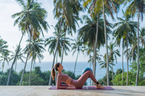 istock Young woman performs yoga outdoors 2093749998