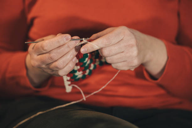 Hands of an unrecognizable woman crocheting