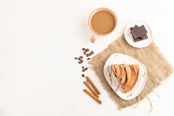 istock Marshmallow cake with cup of coffee on white wooden. top view, copy space. 2093771000