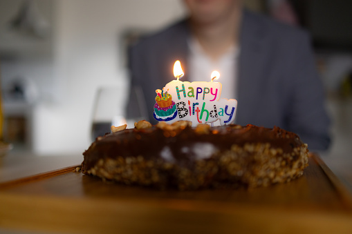 Close up of delicious Birthday cake with candle on top of it. Copy space.