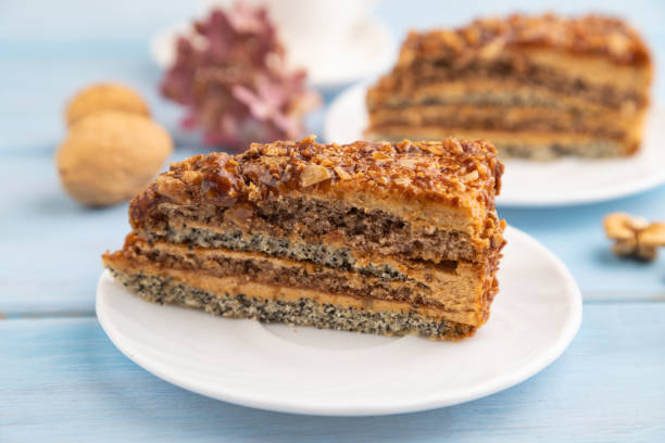 istock Walnut and hazelnut cake with caramel on blue wooden. side view, copy space, selective focus. 2093783162