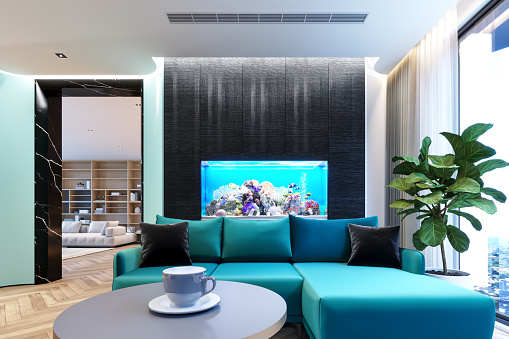 Night Scene Modern Living Room With Metropolis View ,Blue Sofa And Pet Fish In Aquarium