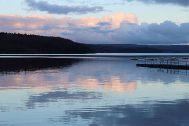 istock Sunset over a countryside lake 2093813534